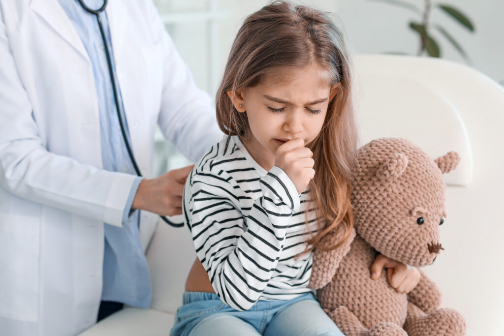 Child coughing due to pneumonia